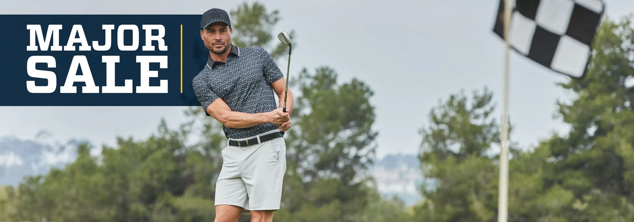 A man practicing chip shots onto a green.