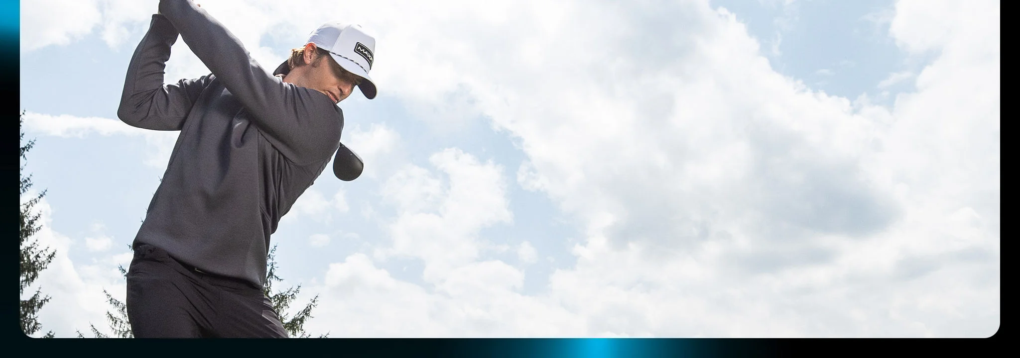 A man teeing off.