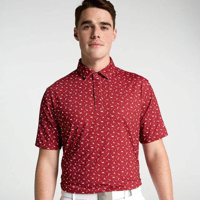Man wearing red patterned polo shirt
