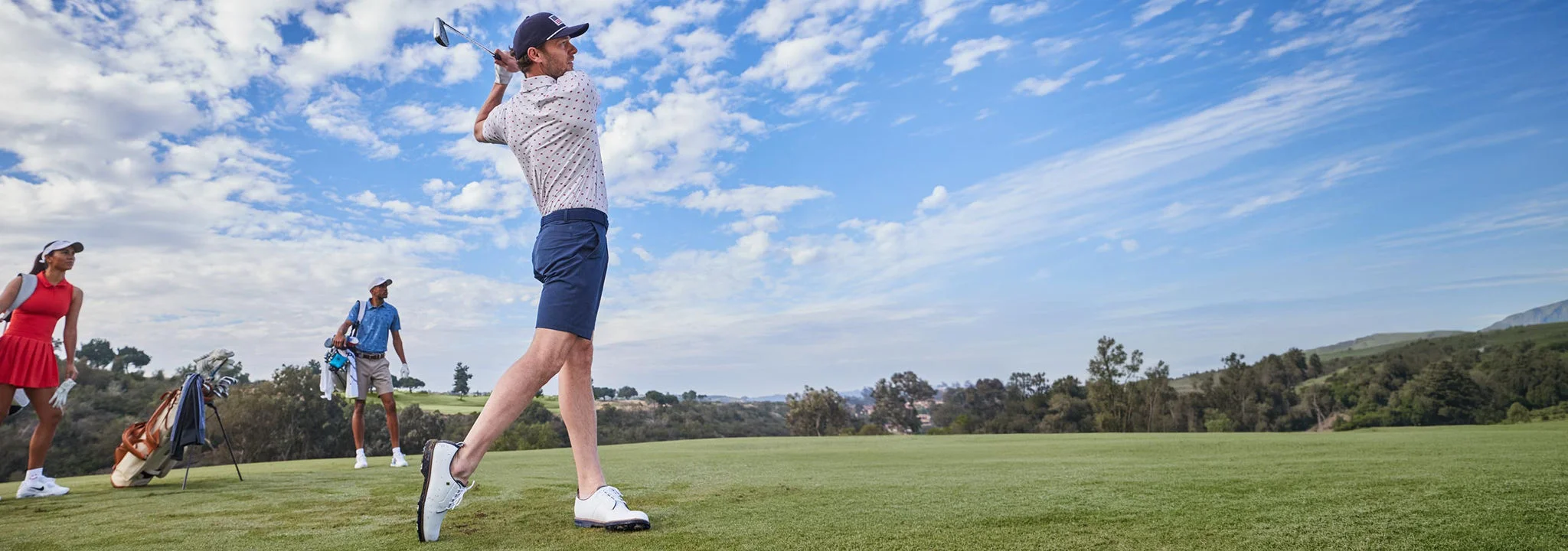 A man Teeing off on a par 3