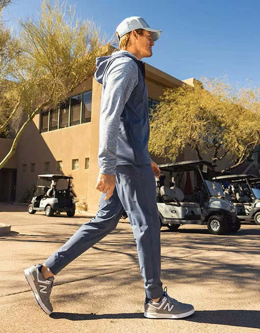 A man wearing VRST golf apparel.
