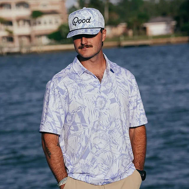 Man in floral print shirt.