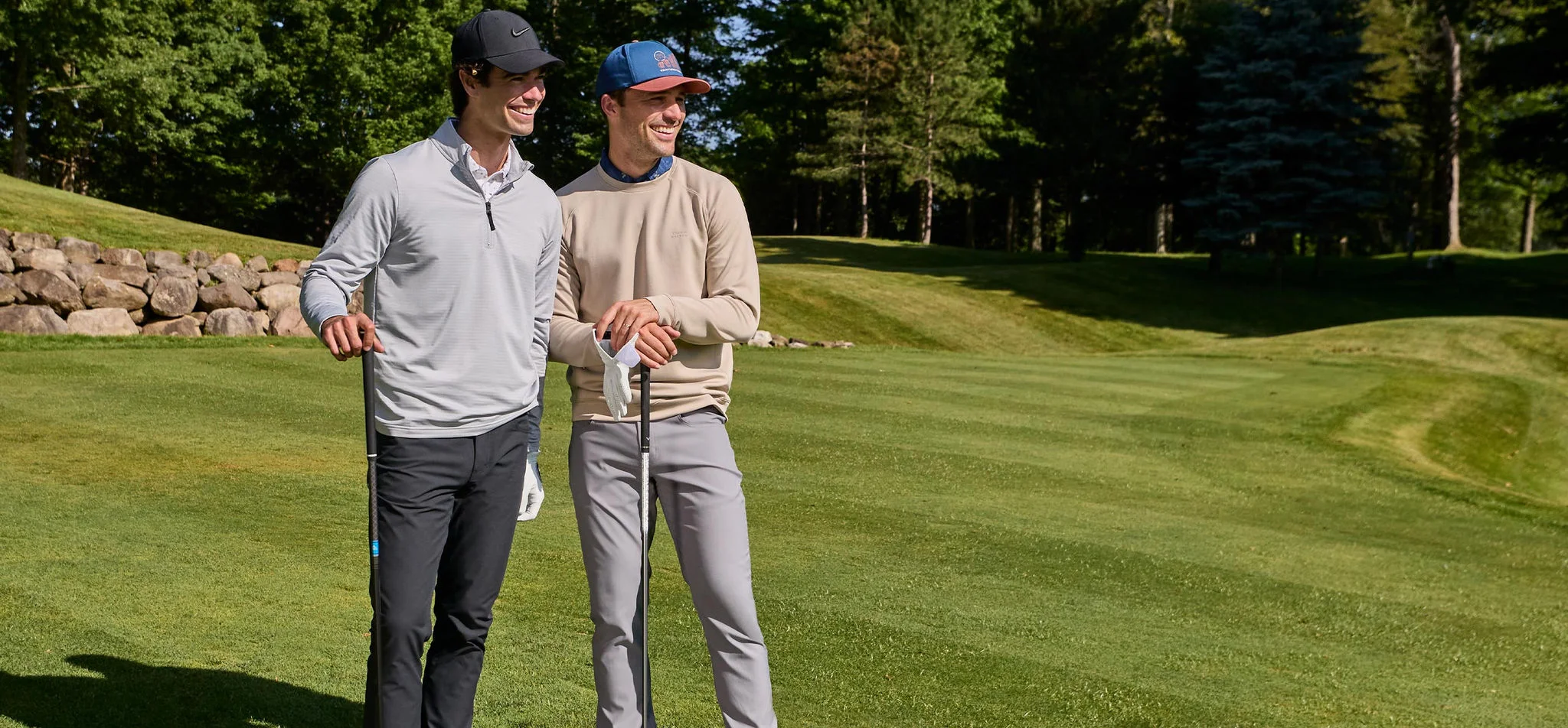 Two men waiting to tee off.
