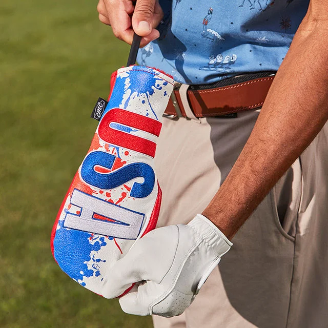 Man holding USA club cover.