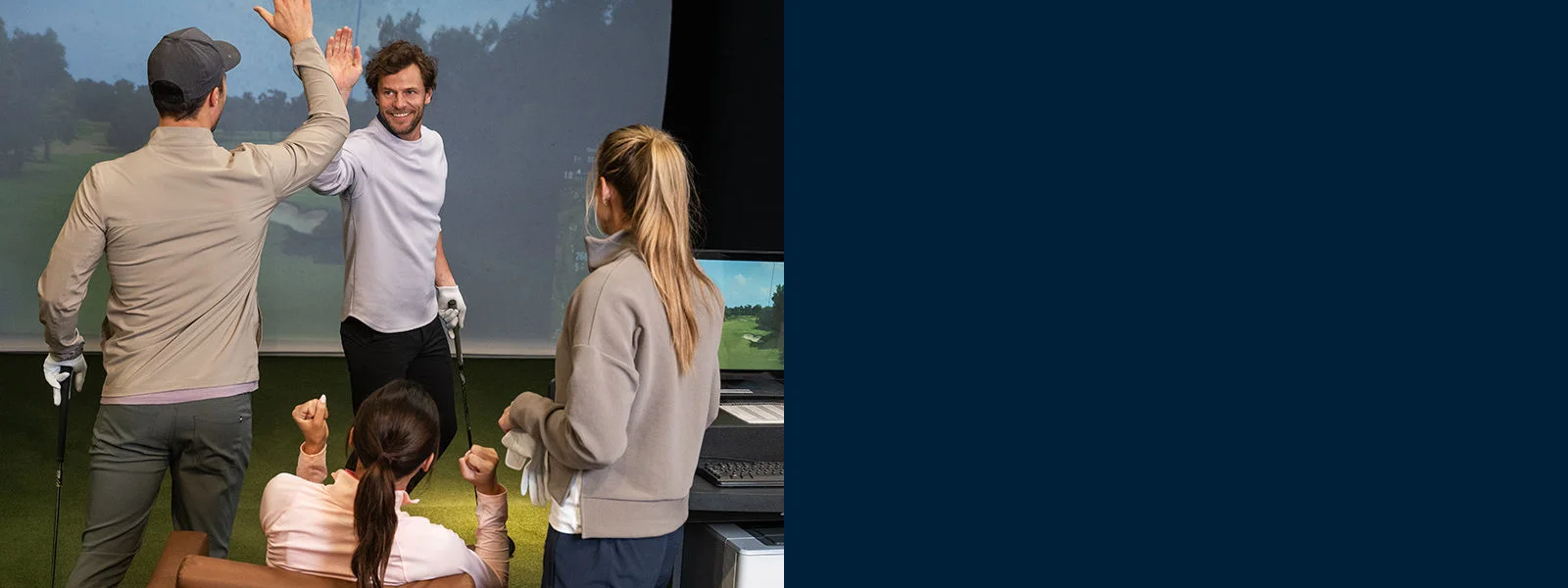 A foursome playing a round in the simulator.