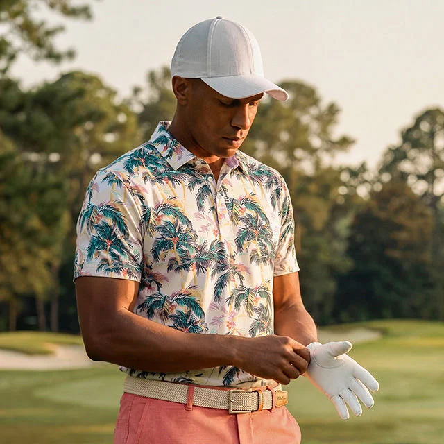 Golfer with hat adjusting glove.