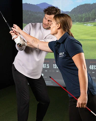 Golf Galaxy teammate assisting a golfer.
