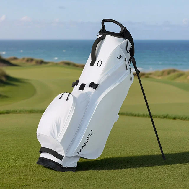 White Maxfli golf bag on a course.