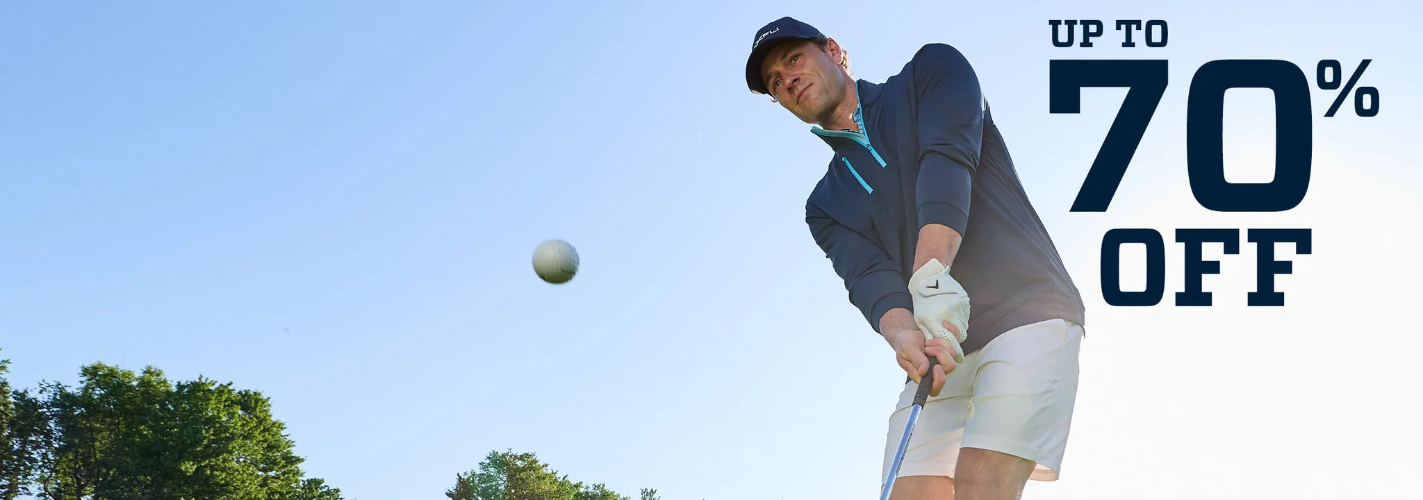 A man swinging a wedge.
