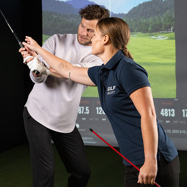 person at golf lesson