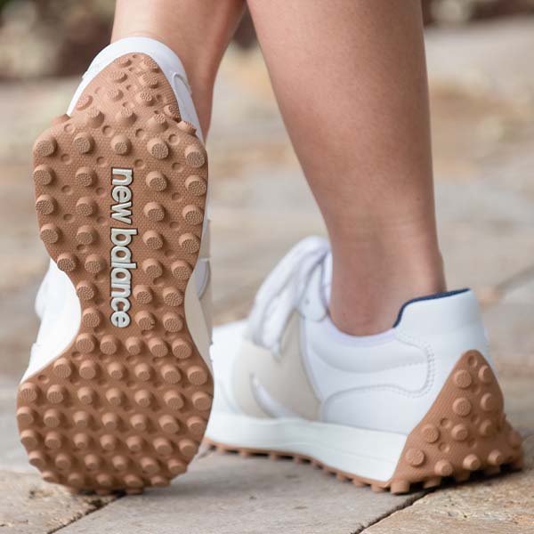 new balance 327 shoes on stone walkway