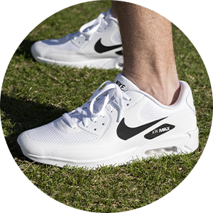 white Nike golf shoes.