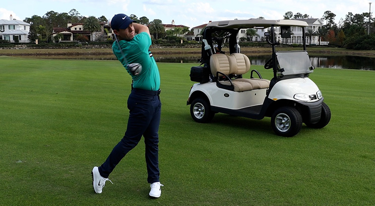 An image of professional golfer Rory McIlroy swinging a club. 